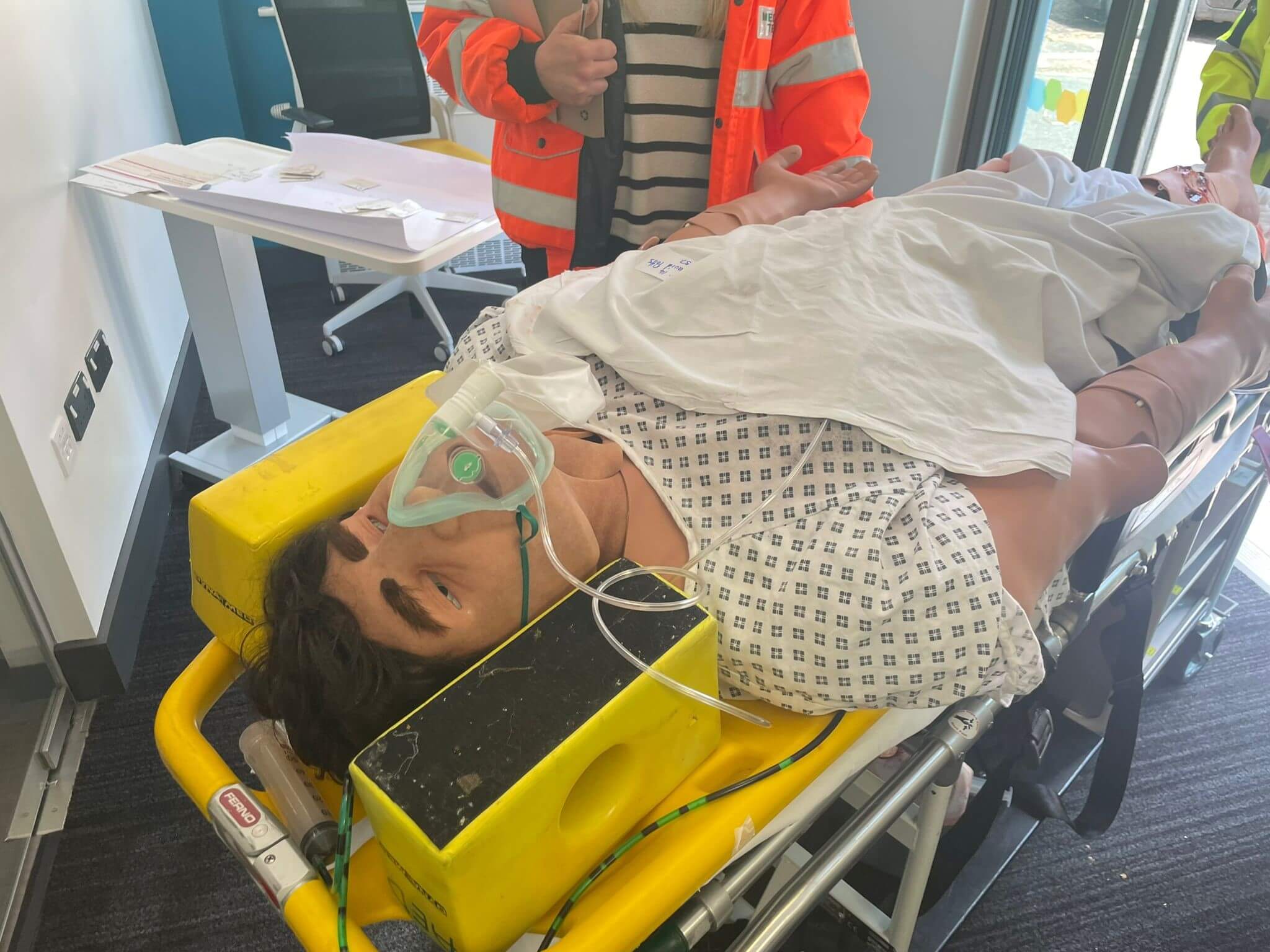 Mannequin on a mobile patient bed