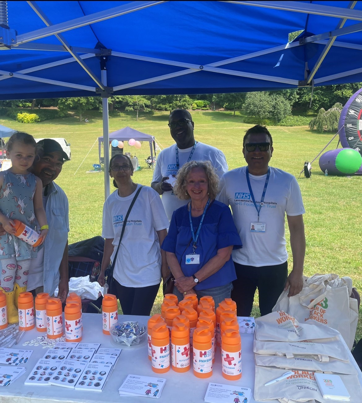 Jonathan Grisdale is pictured, second left, working as a volunteer for the Trust at the Windrush 75 event at Avenham Park, Preston, on Sunday