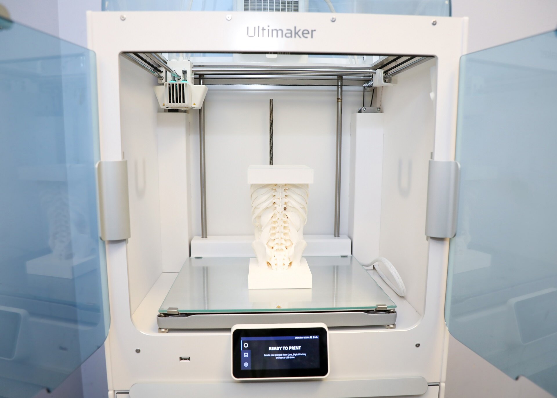 A photo of 3D printed bones inside a 3D printing machine
