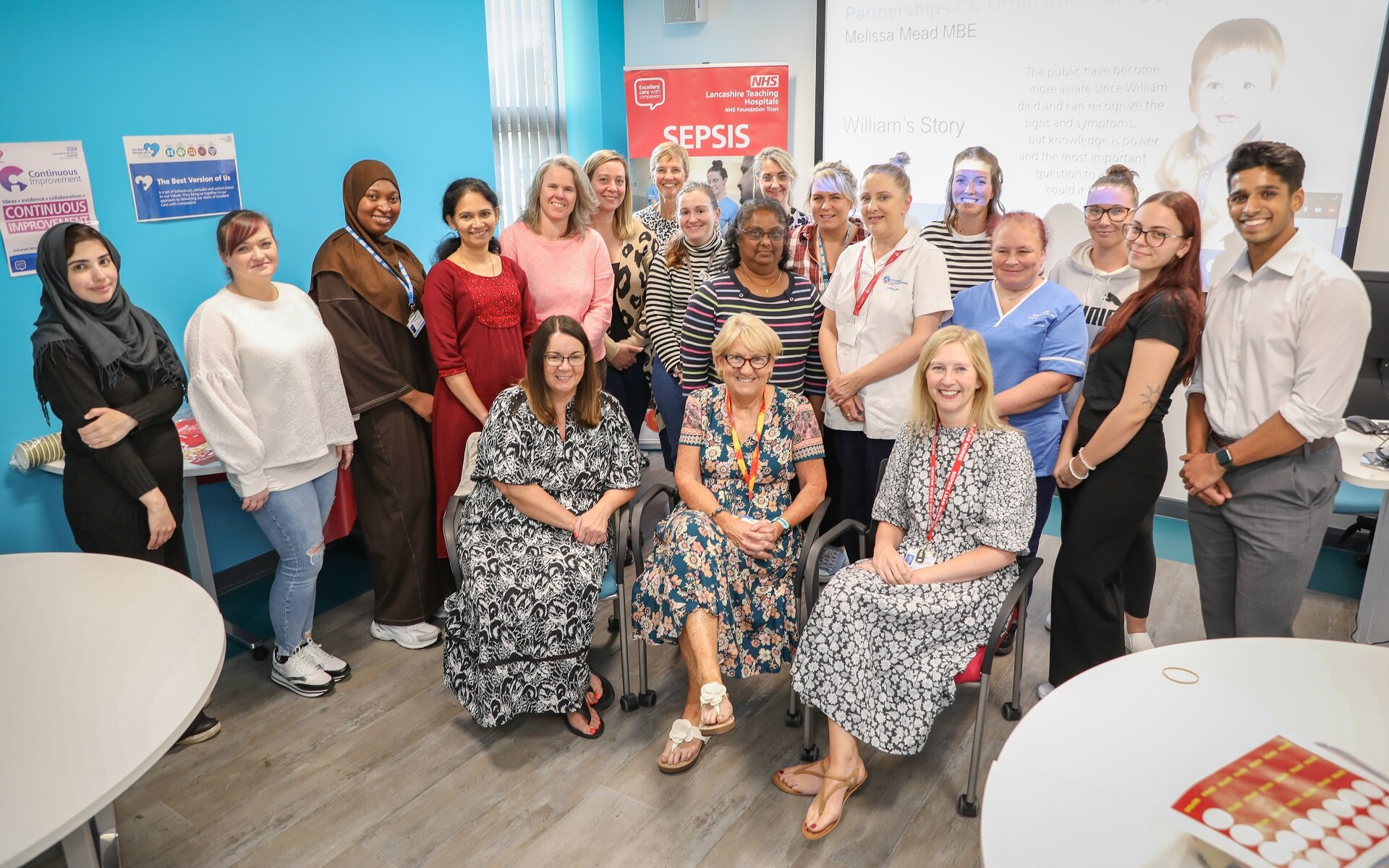 A group photo of people who attend a sepsis awareness seminar