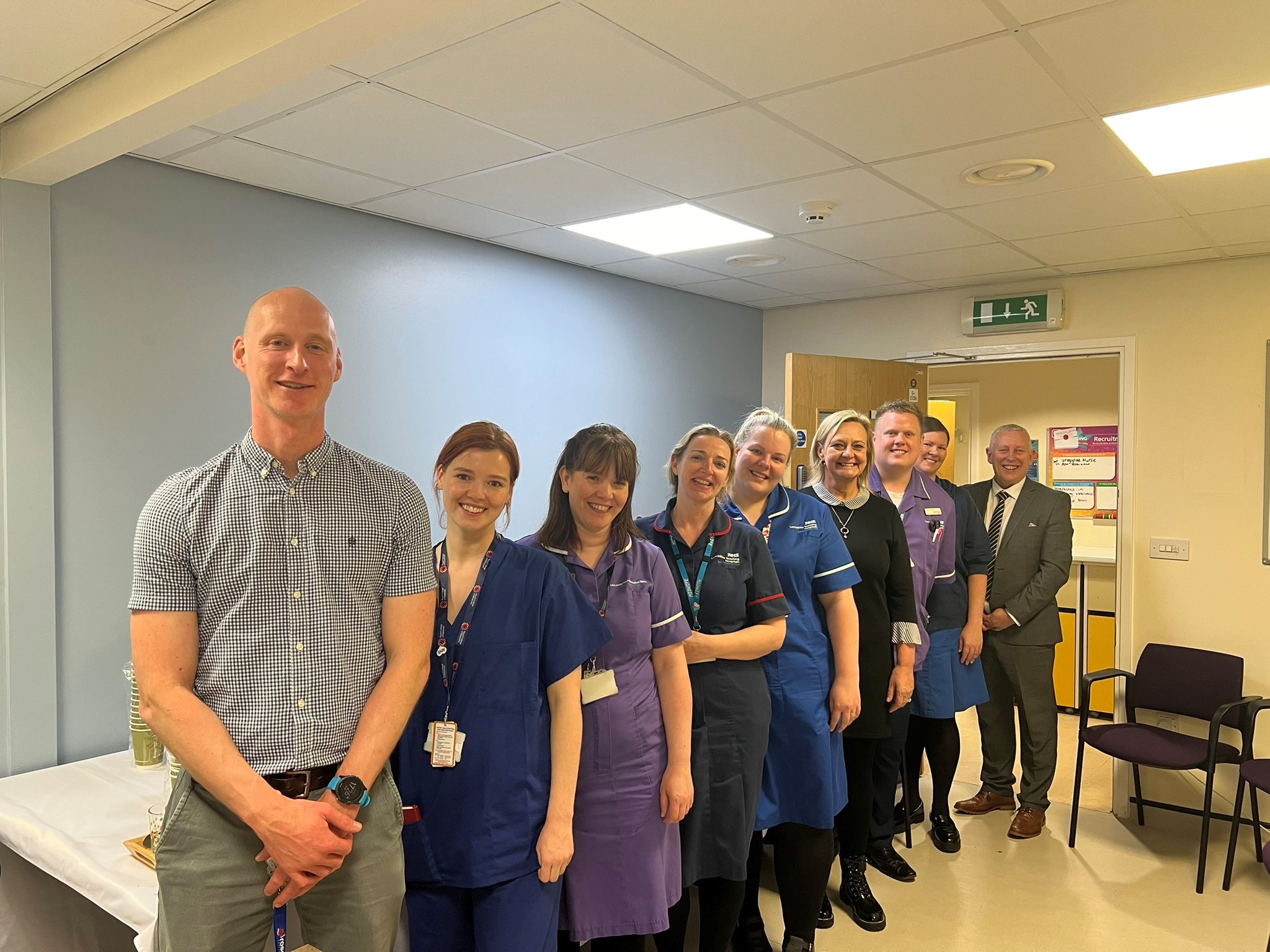 Group photo of staff members during opening