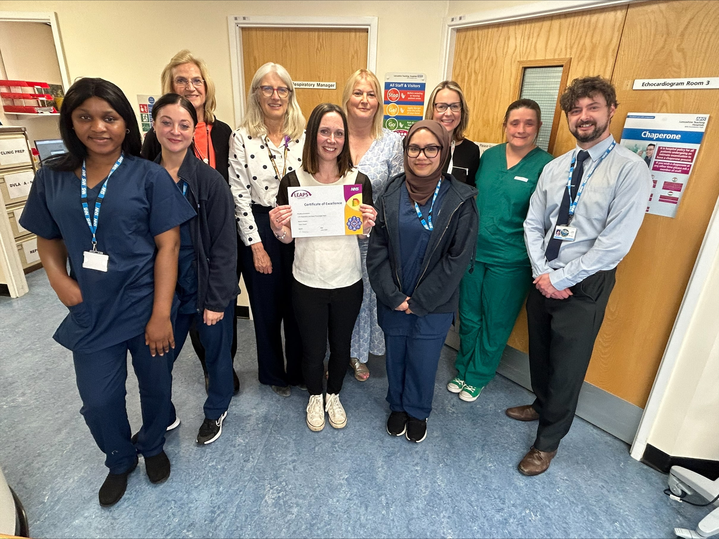 Team photo - staff members holding award certificate
