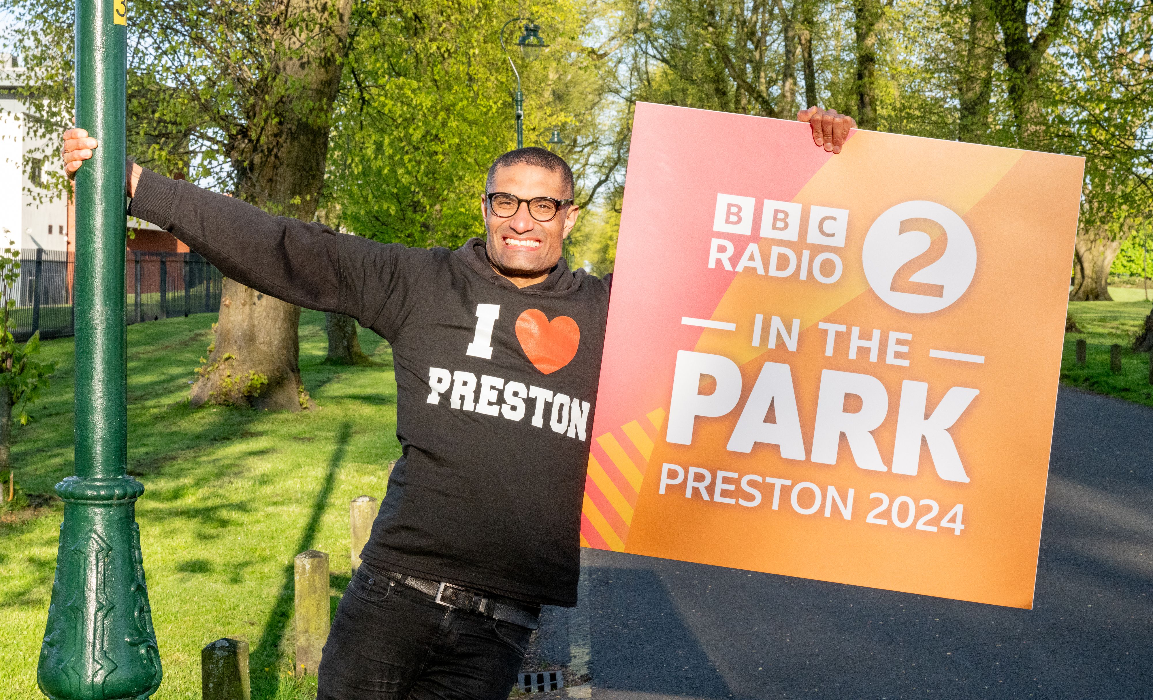 Photo of person holding radio sign