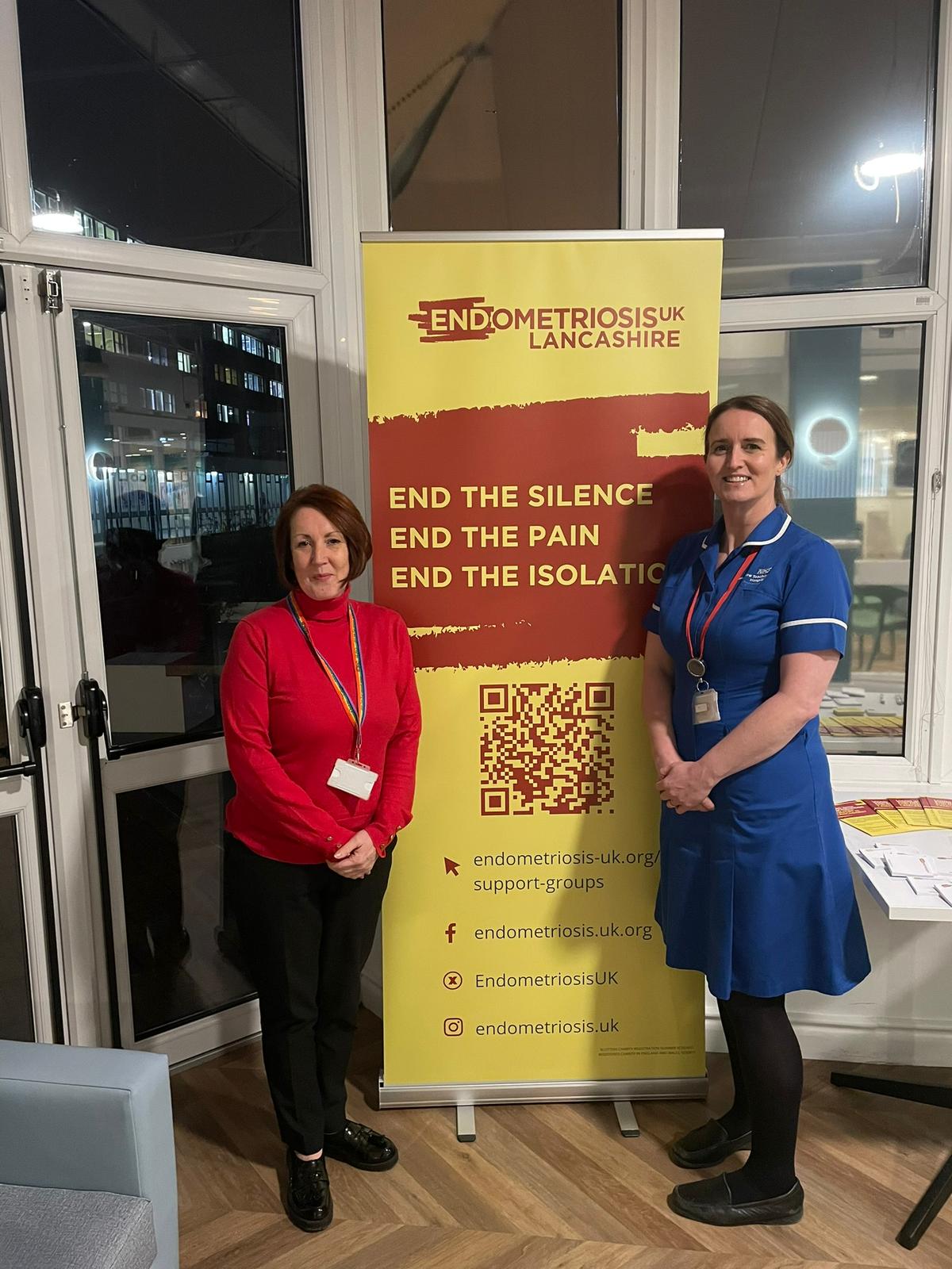 Photo of NHS staff next to Endometriosis UK banner