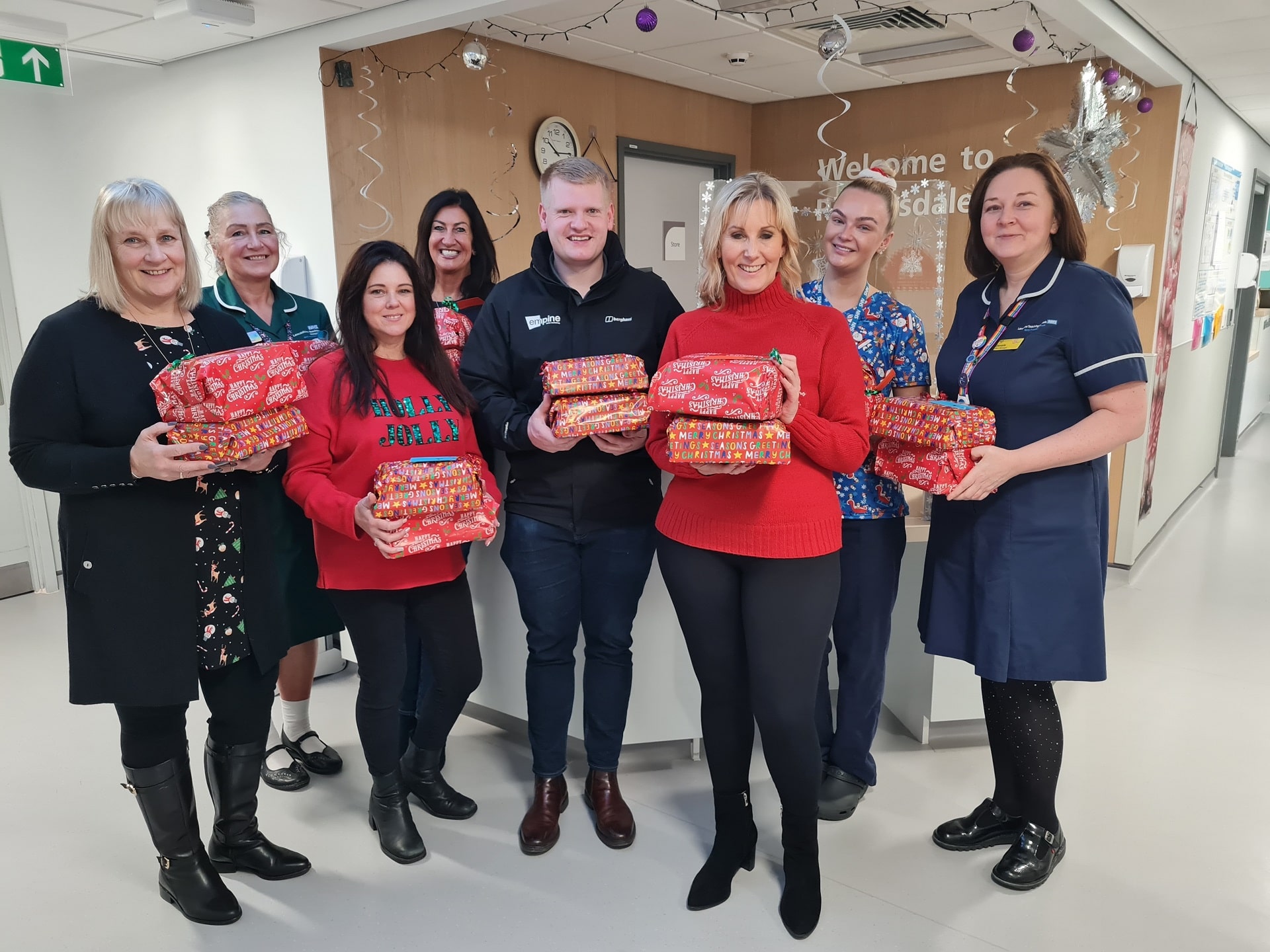 BNI (Business Group) holding presents alongside Wigan Warriors in NHS healthcare environment