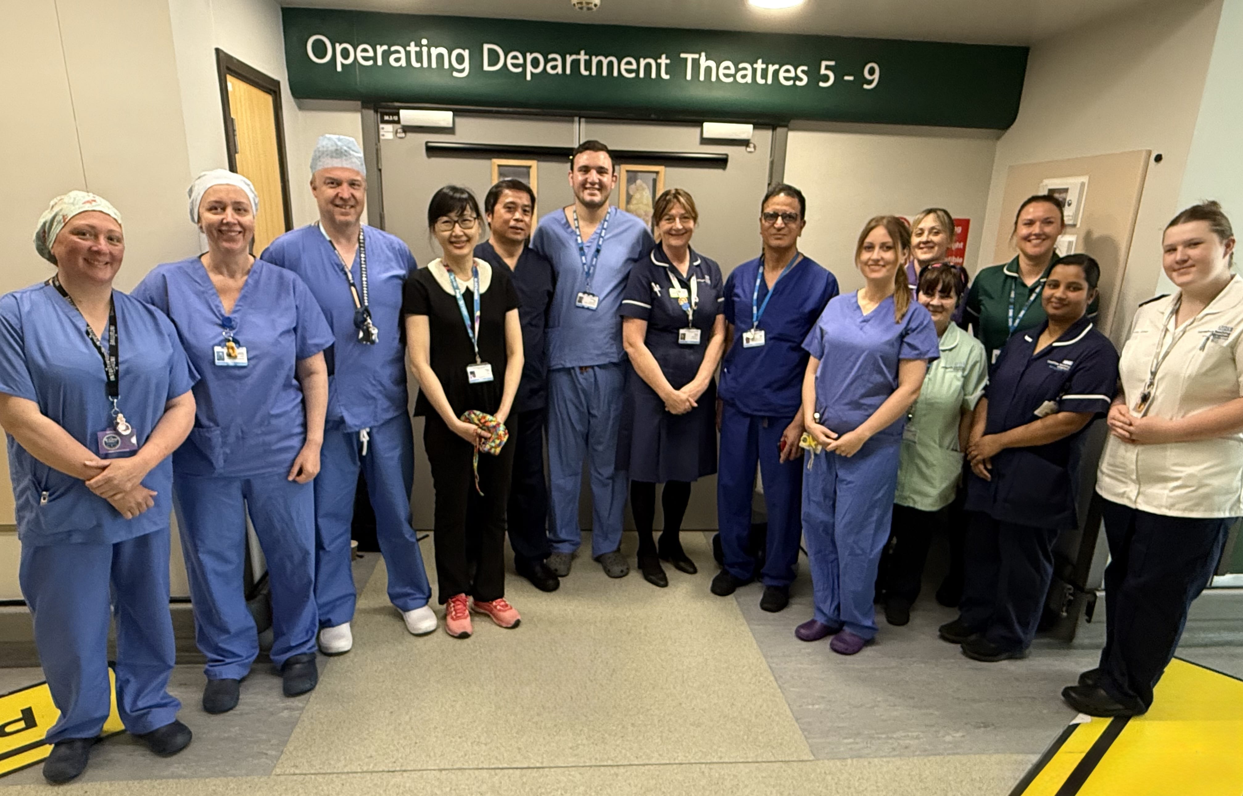NHS Staff group photo in front of Operating Department Theatres 5-9