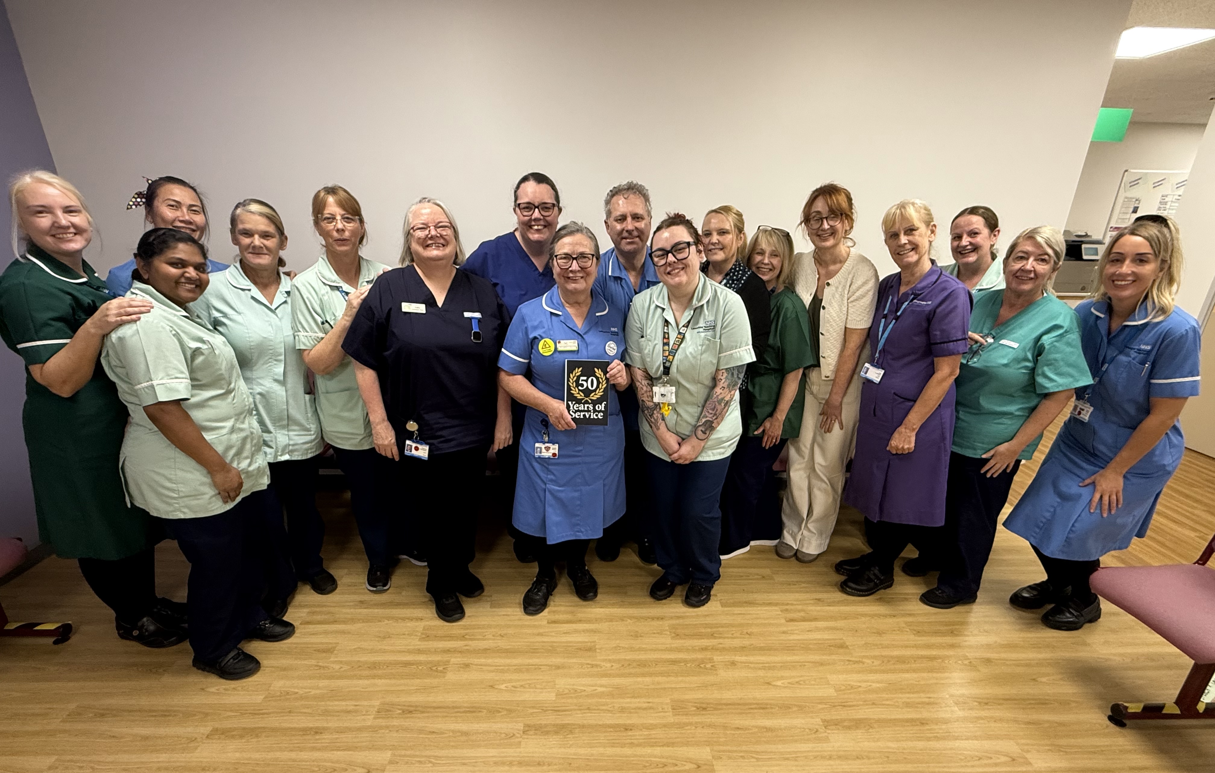 Angela Wilson in a group photo with lots of NHS colleagues