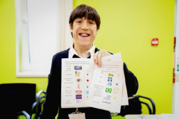 man holding an Our Health Day document