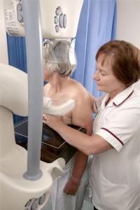 patient having a mammogram assisted by a nurse