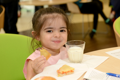 Little girl enjoying food at the hospital